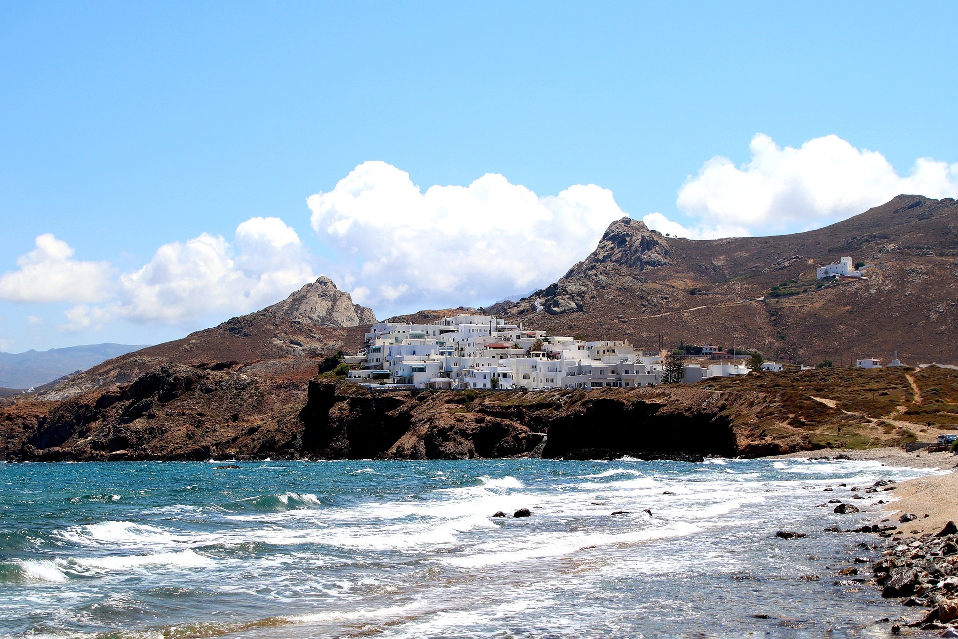 cyclades islands - The 8 Best Cyclades Islands to Visit This Summer Cliff and town in Naxos, Greece