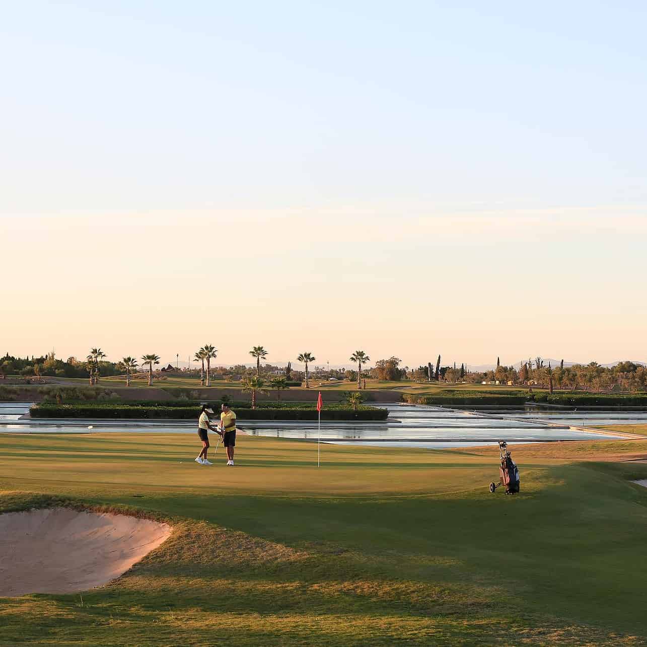 Golfing in Marrakech - Where to Experience the Best Golfing in Marrakech End of the day on the green of the 17th hole at the Al Maaden Golf Marrakech in Morocco.