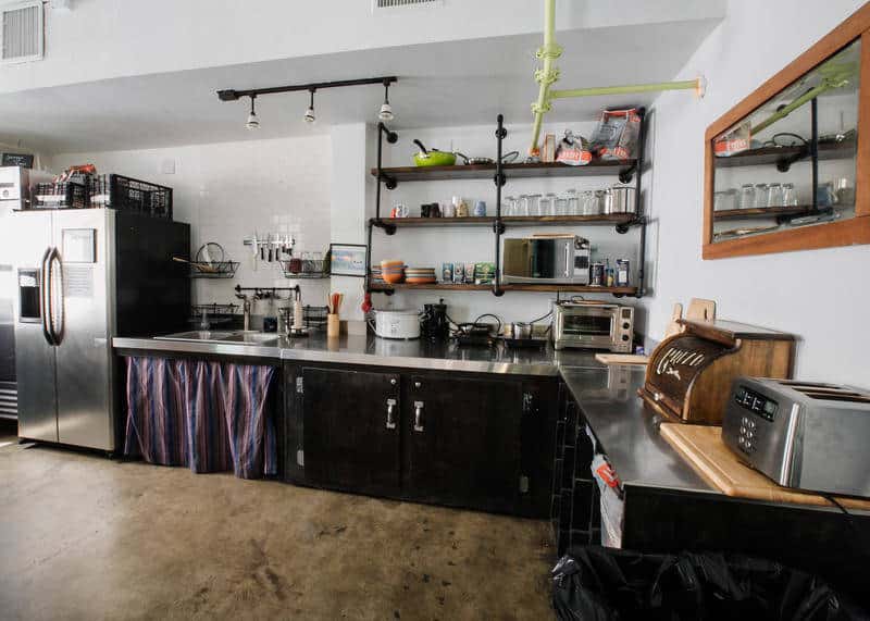 staying at a hostel - The Ultimate Guide to Staying at a Hostel Kitchen at the Firehouse Hostel, Austin
