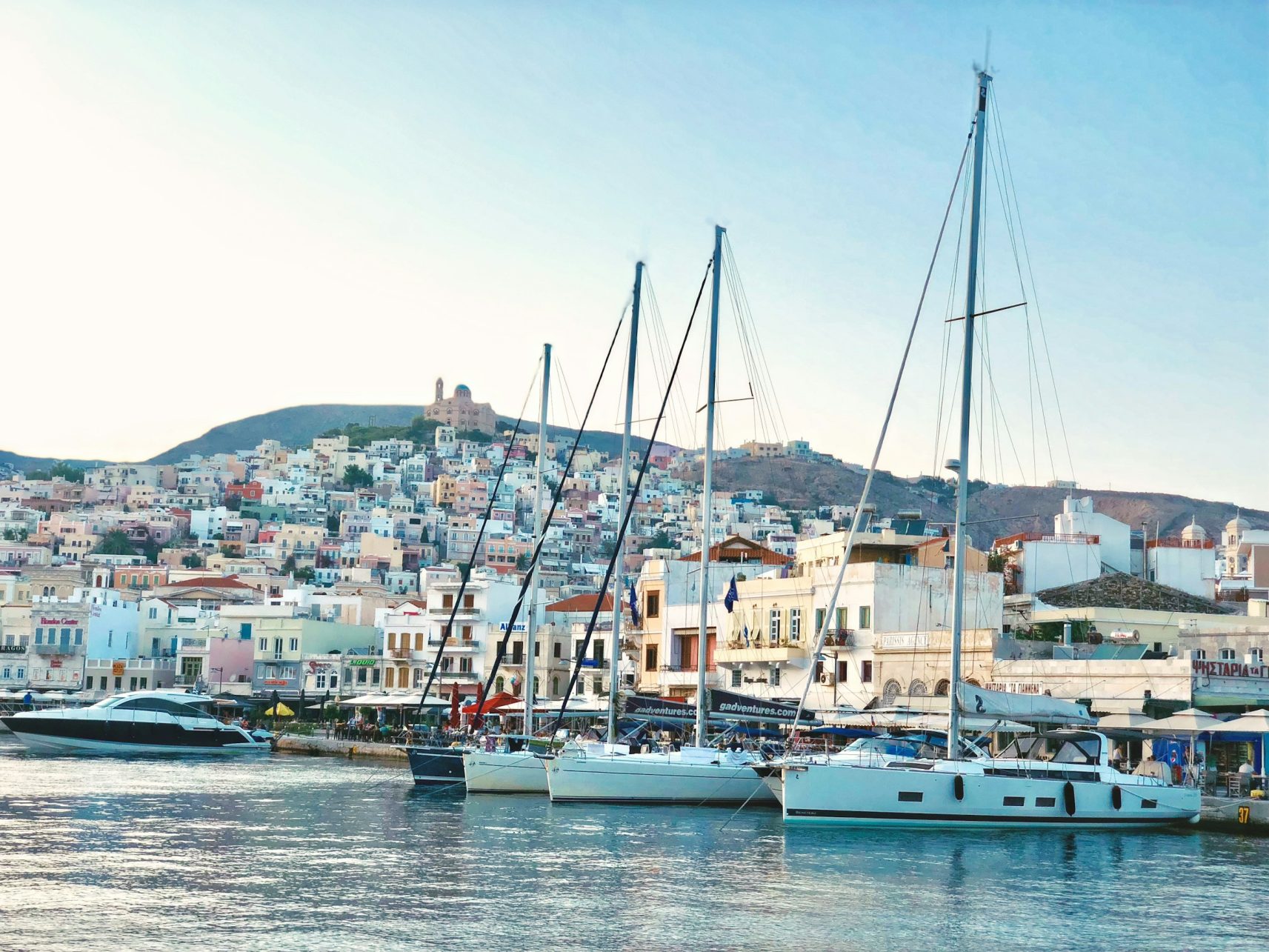 cyclades islands - The 8 Best Cyclades Islands to Visit This Summer Harbor and waterfront in Syros, Greece.