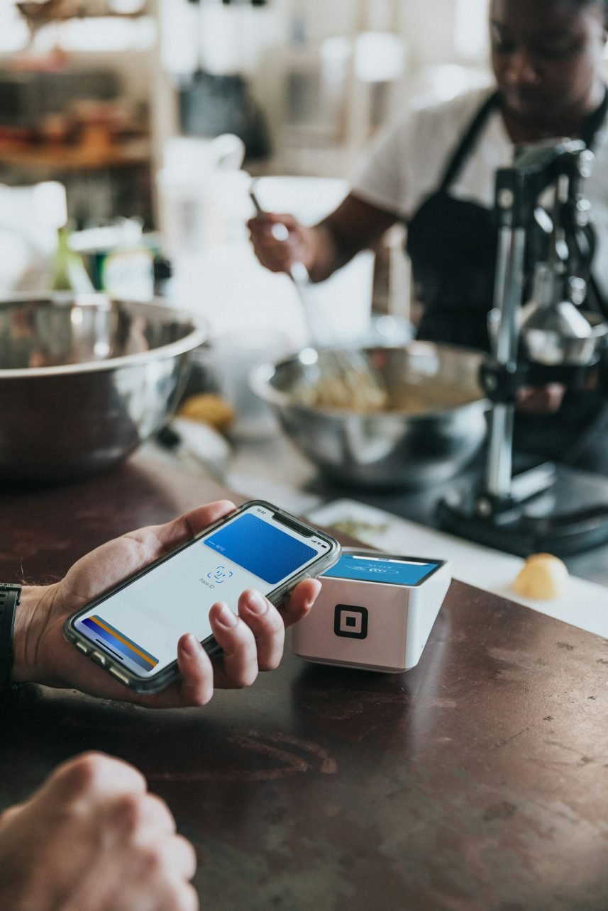 How to Choose the Right Travel Insurance - How to Choose the Right Travel Insurance: An Analytical Guide A person holding a phone, who is paying with the credit card.