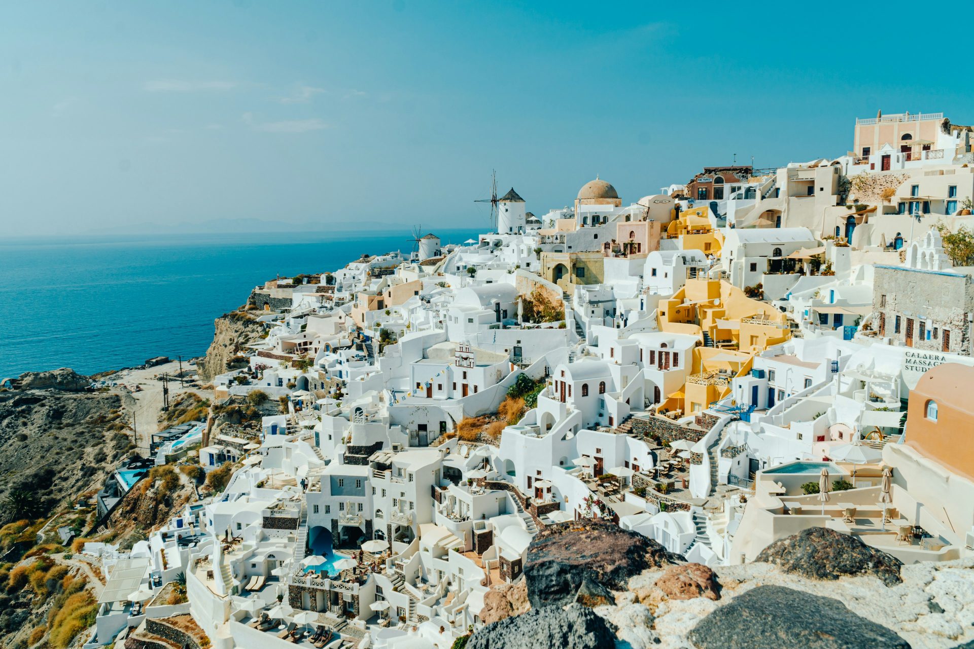 cyclades islands - The 8 Best Cyclades Islands to Visit This Summer Aerial view of a village in Santorini