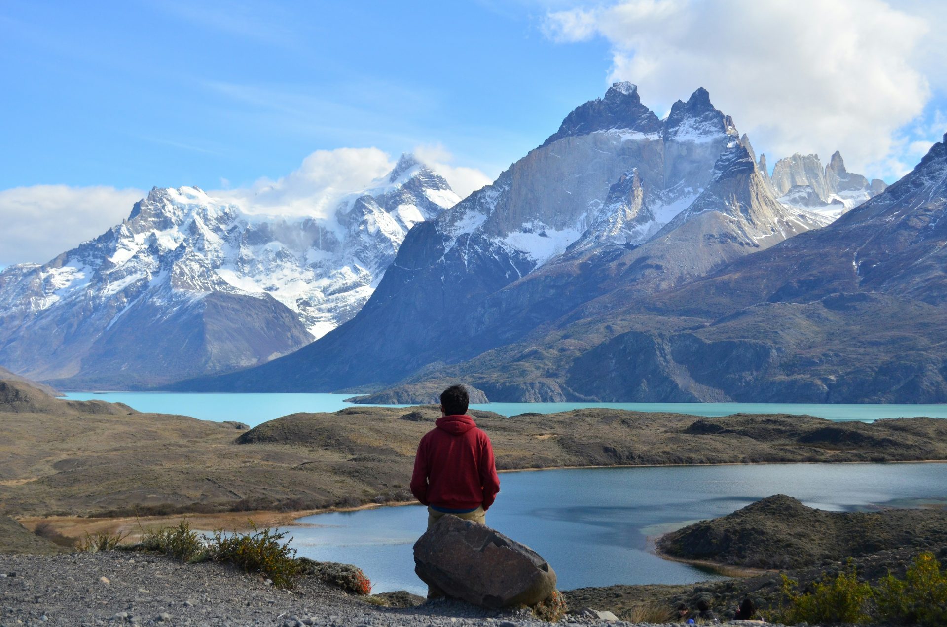 - Thrill-Seeker's Guide: Top Destinations for the Bold & Brave Sitting at the Lago Grey, Torres de Paine, Chile.