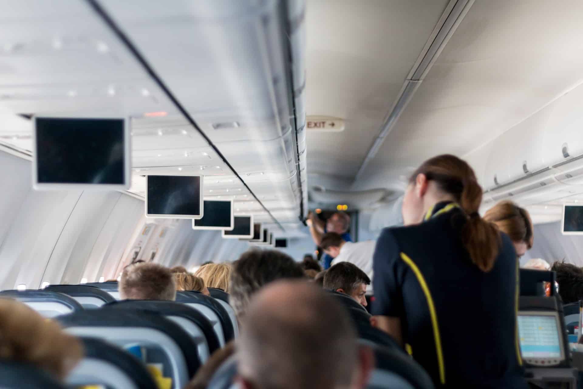 fear of flying - Overcoming Your Fear of Flying: Tips to Transform Your Flight Experience Stewardess in the plane