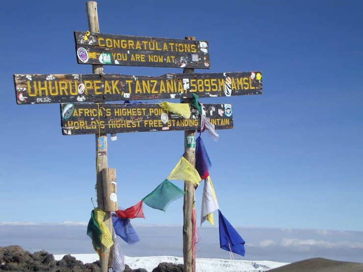 Hiking to the summit of Mount Kilimanjaro in Tanzania.