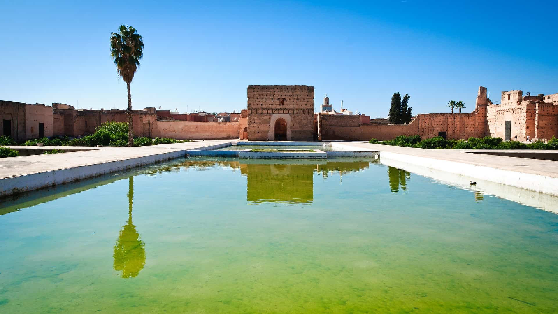 Places to Visit in Marrakech - Not to Miss Cultural & Historic Places to Visit in Marrakech Waterpool at the Badi Palace in Marrakech, Morocco.