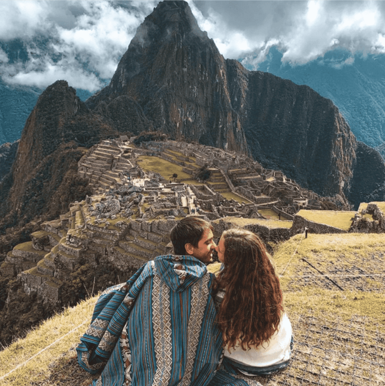 Visiting Machu Picchu - 10 Things to Know Before Visiting Machu Picchu A couple visiting Machu Picchu in Peru.