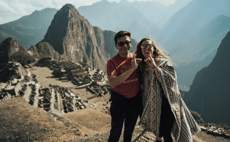 altitude sickness in Peru - How to Avoid Altitude Sickness in Peru Couple at Machu Picchu - exploor Peru. How to avoid altitude sickness.